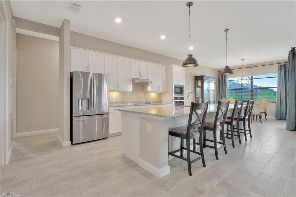 11721 Canopy Loop Fort Myers, FL 33913 - Photo 29 of 40 Wide Open Kitchen w/ Massive Island for Entertaining