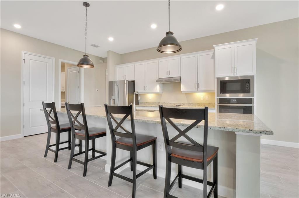 11721 Canopy Loop Fort Myers, FL 33913 - Photo 31 of 40 LED Lighting along w/ Pendant Lighting w/ Upgraded Cabinets
