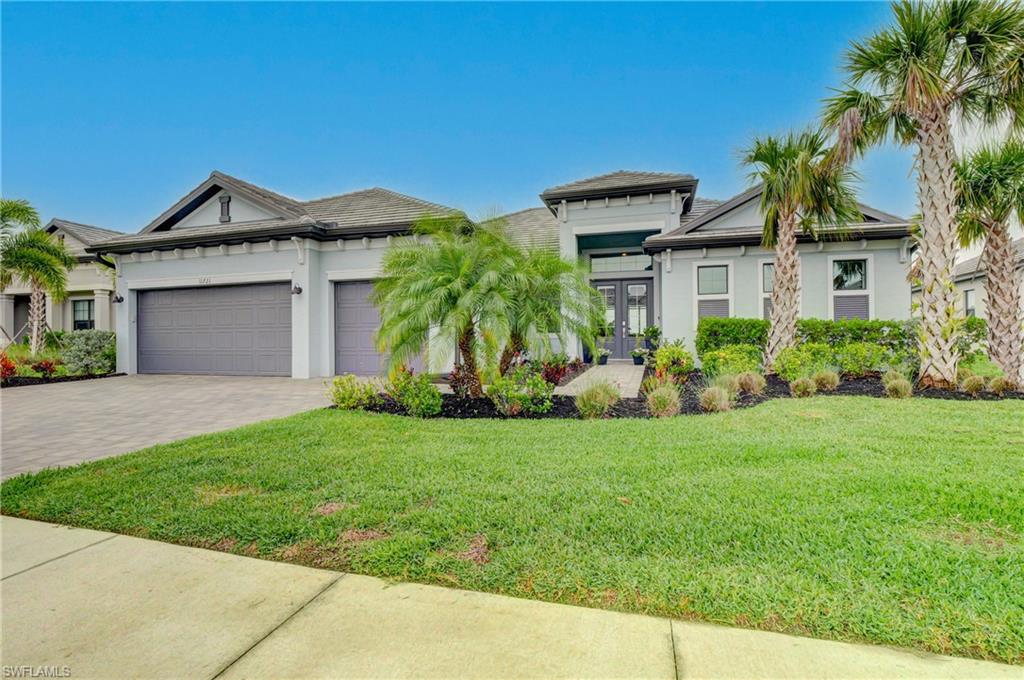 11721 Canopy Loop Fort Myers, FL 33913 - Photo 4 of 40 Beautifully Landscaped Entrance