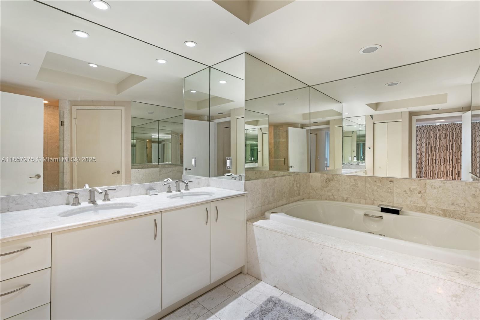 1331 Brickell Bay Drive, Unit 2709 Miami, FL 33131 - Photo 7 of 16 Primary bathroom with separate shower and tub