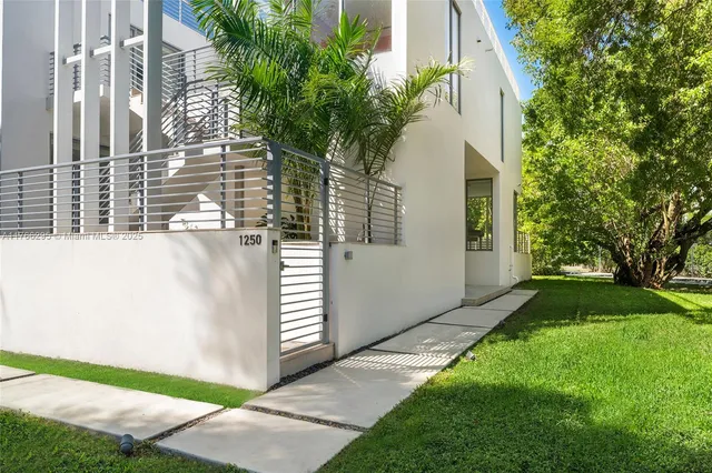 a room with stairs and a large window