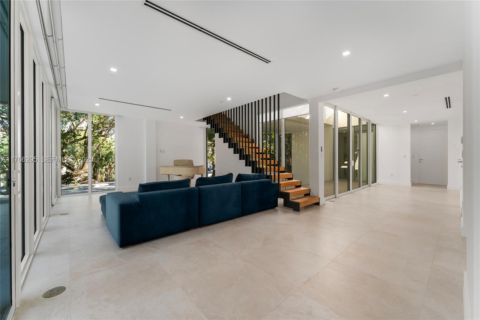 1250 North Venetian Way Miami, FL 33139 - Photo 20 of 61 a living room with furniture and a large window