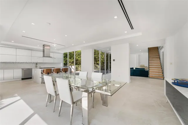 a kitchen with stainless steel appliances granite countertop a sink and refrigerator