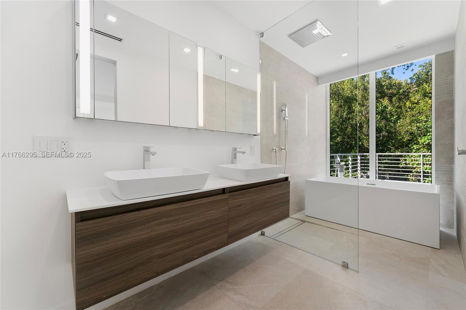 1250 North Venetian Way Miami, FL 33139 - Photo 32 of 61 a spacious bathroom with a sink and a bathtub