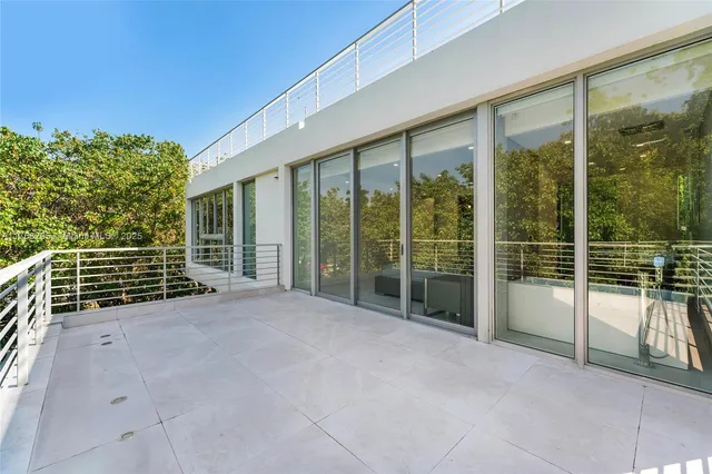 a bathroom with a shower and a sink