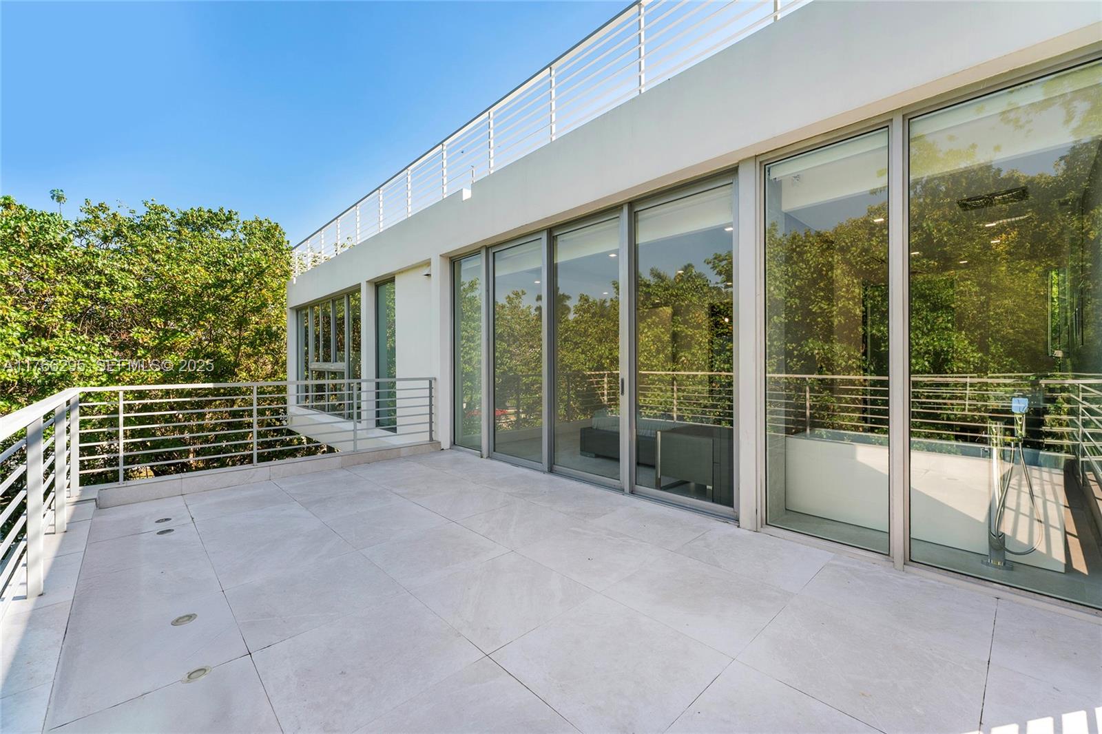 1250 North Venetian Way Miami, FL 33139 - Photo 33 of 61 a view of an empty room with a balcony