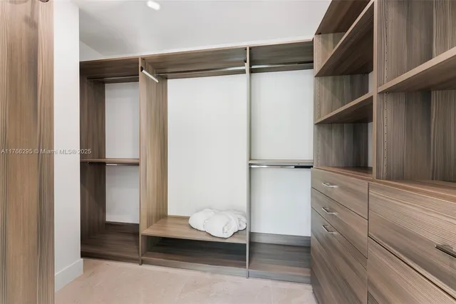 a view of a big room with wooden floor and garden