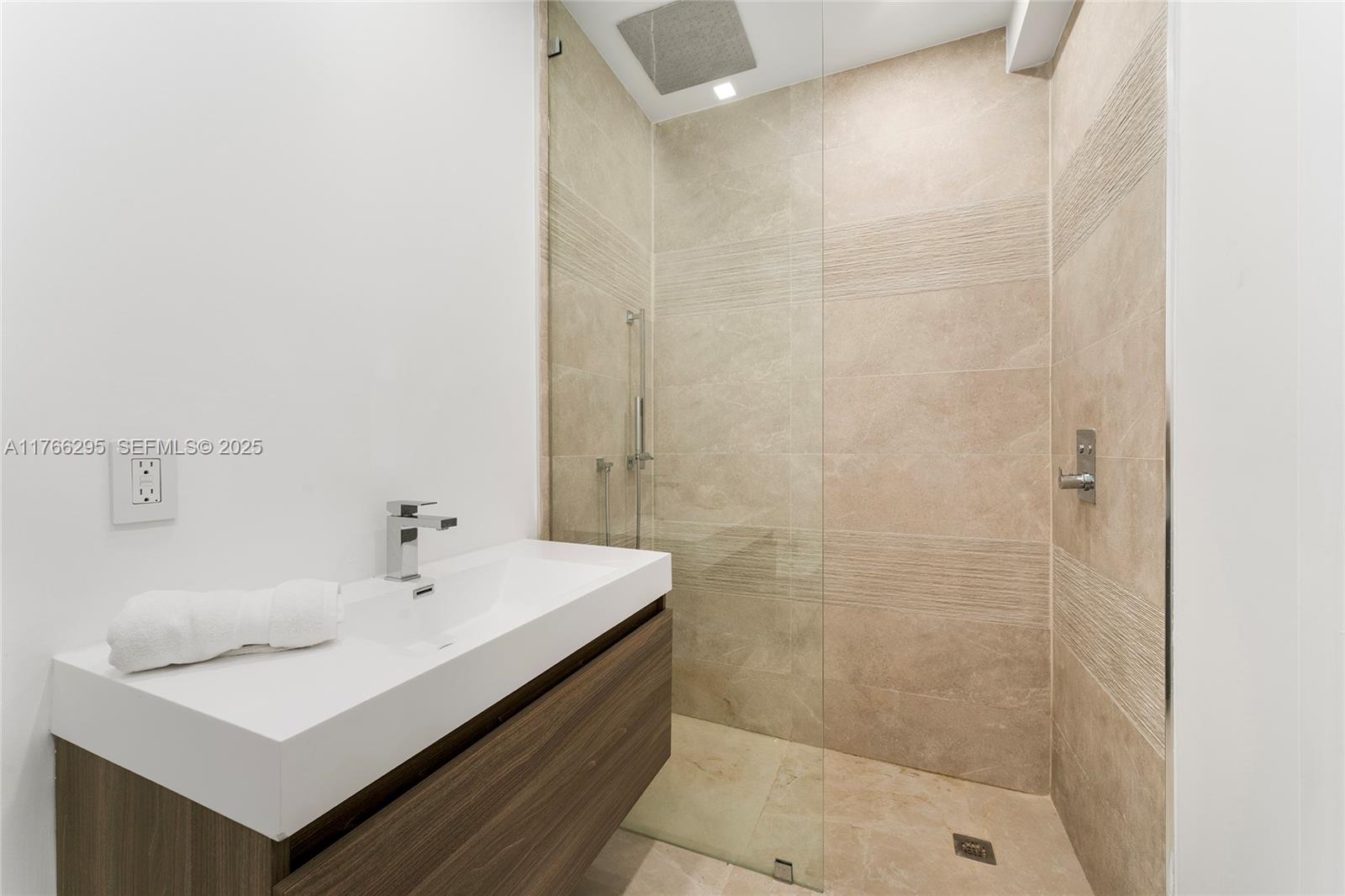 1250 North Venetian Way Miami, FL 33139 - Photo 41 of 61 a bathroom with a sink and a shower