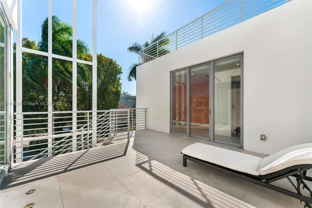 an aerial view of a house with outdoor space