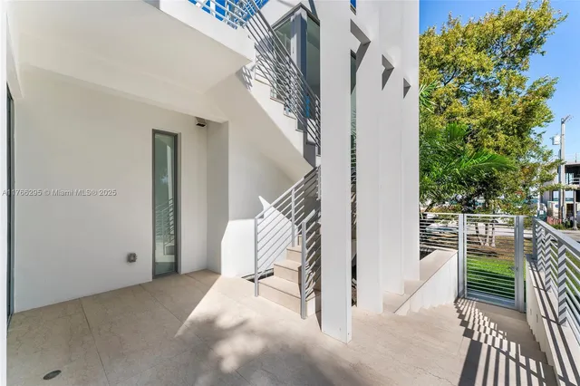 an aerial view of a house with a garden