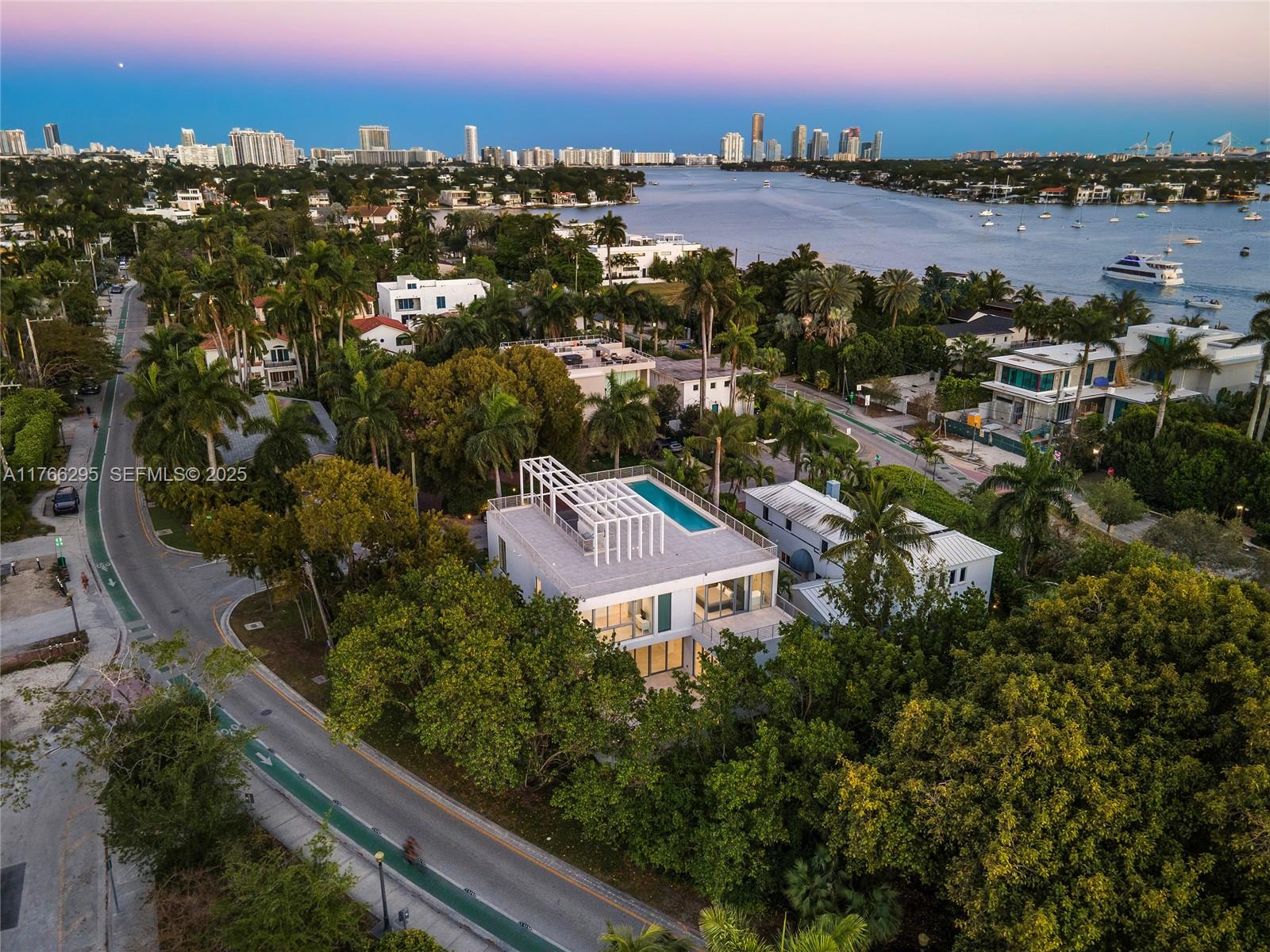 1250 North Venetian Way Miami, FL 33139 - Photo 60 of 61 an aerial view of lake and city