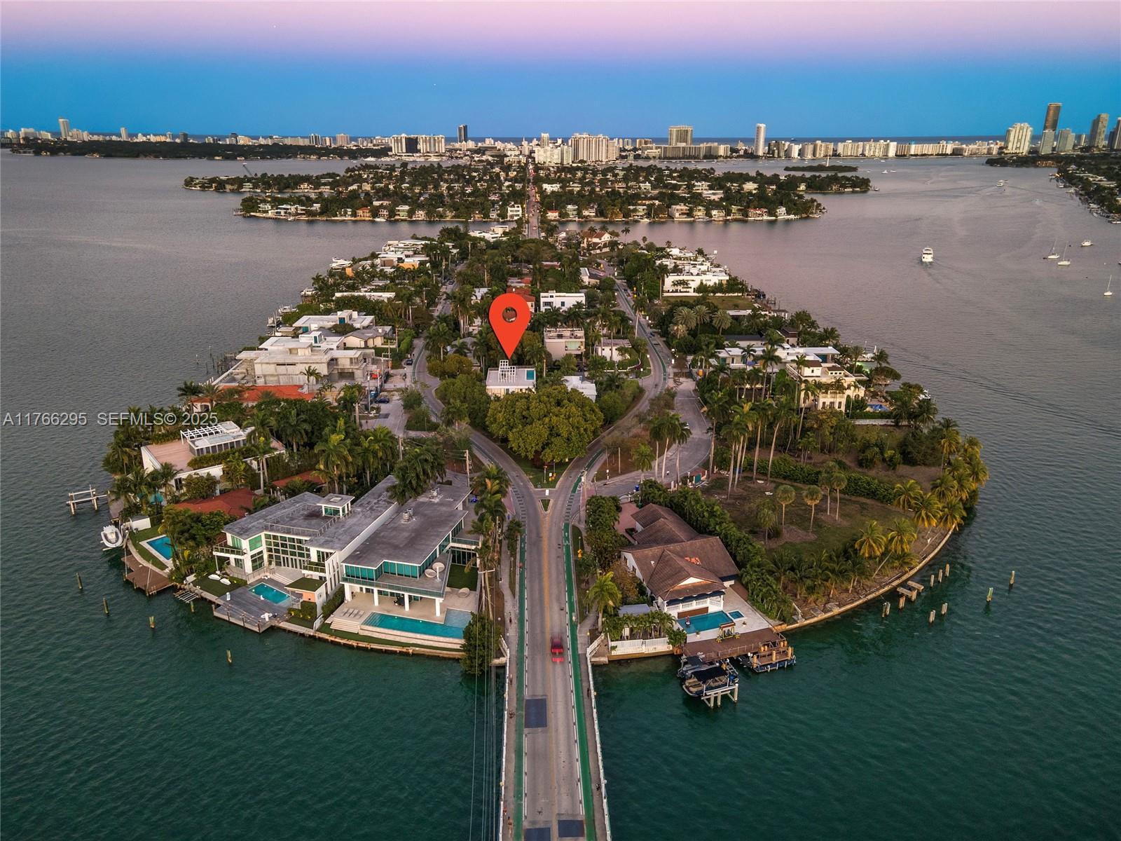 1250 North Venetian Way Miami, FL 33139 - Photo 61 of 61 an aerial view of a house with a garden and lake view