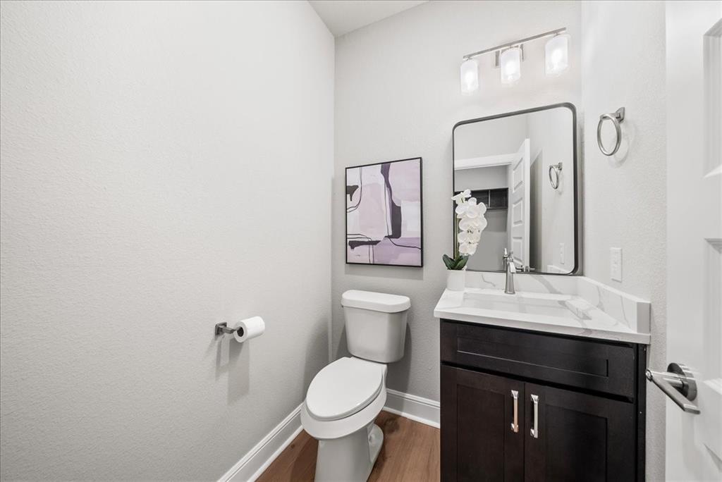 6421 Starlight Ranch Road Godley, TX 76044 - Photo 18 of 39 a bathroom with a sink and a toilet