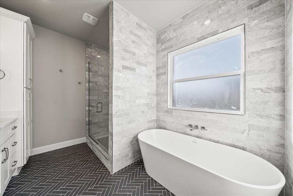 6421 Starlight Ranch Road Godley, TX 76044 - Photo 21 of 39 a bathroom with a bathtub and shower