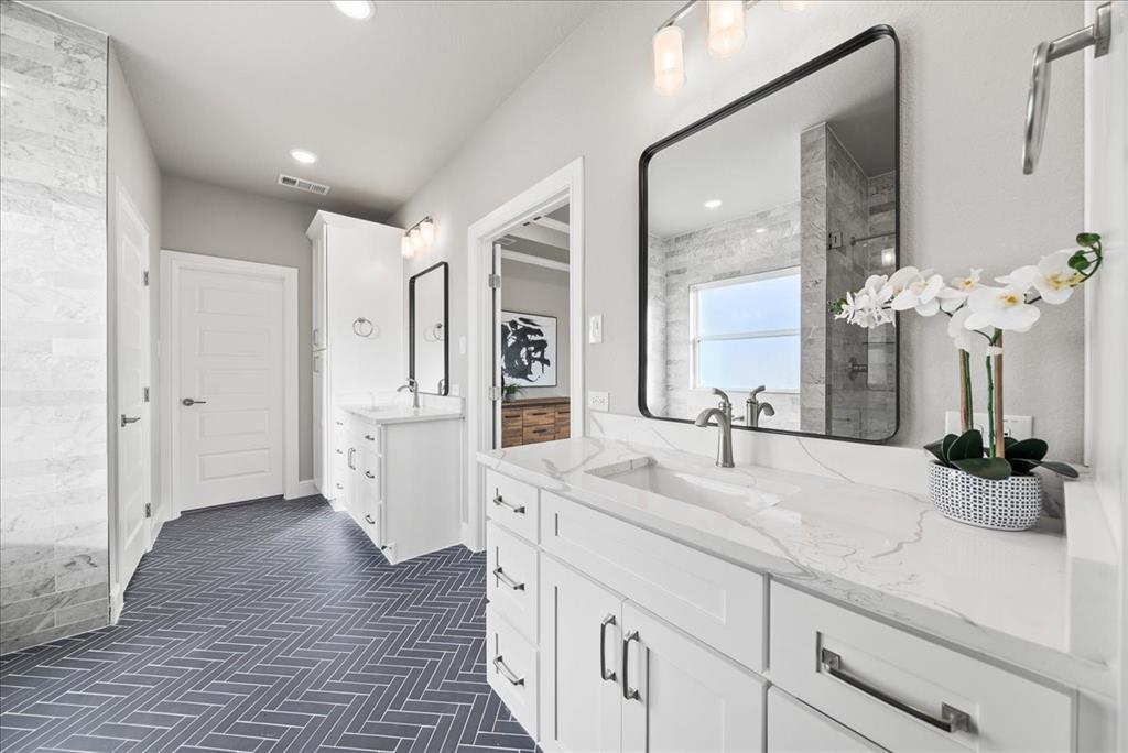 6421 Starlight Ranch Road Godley, TX 76044 - Photo 24 of 39 a spacious bathroom with double vanity and a mirror