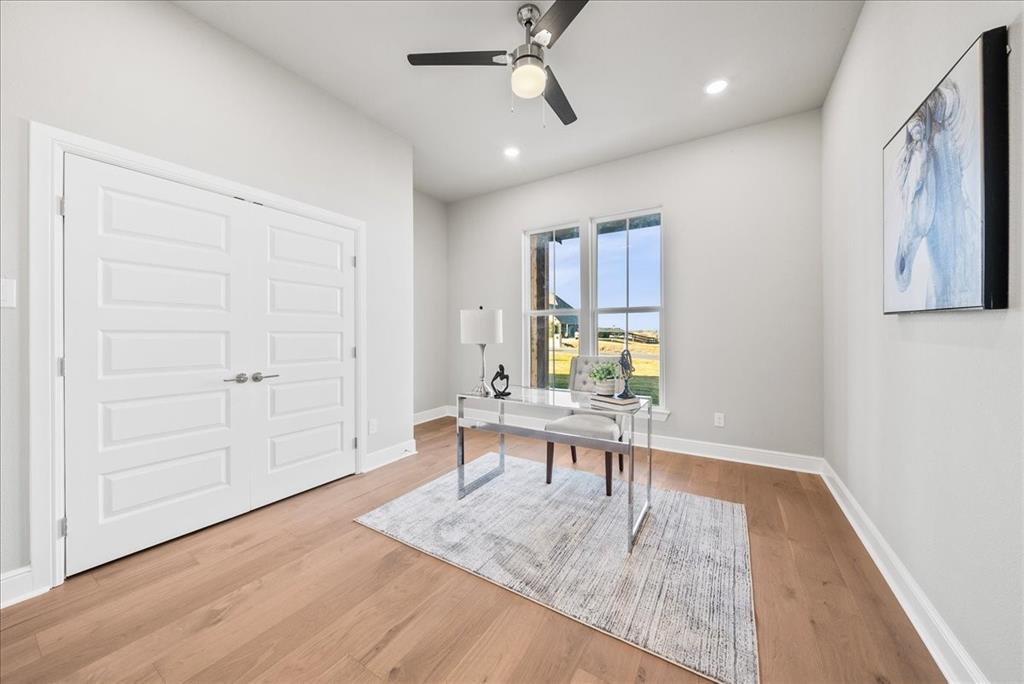 6421 Starlight Ranch Road Godley, TX 76044 - Photo 31 of 39 wooden floor view with dining table and chairs