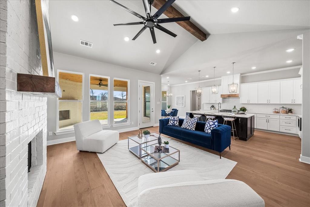 6421 Starlight Ranch Road Godley, TX 76044 - Photo 7 of 39 a living room with furniture fireplace and flat screen tv