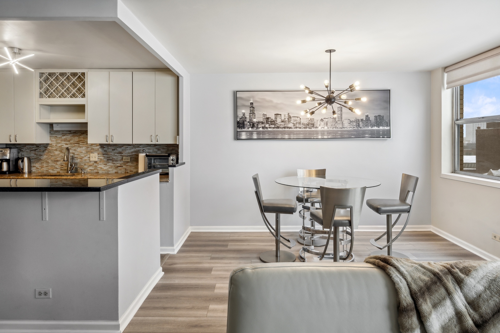 6301 North Sheridan Road, Unit 8E Chicago, IL 60660 - Photo 6 of 19 a view of a dining room with furniture and wooden floor