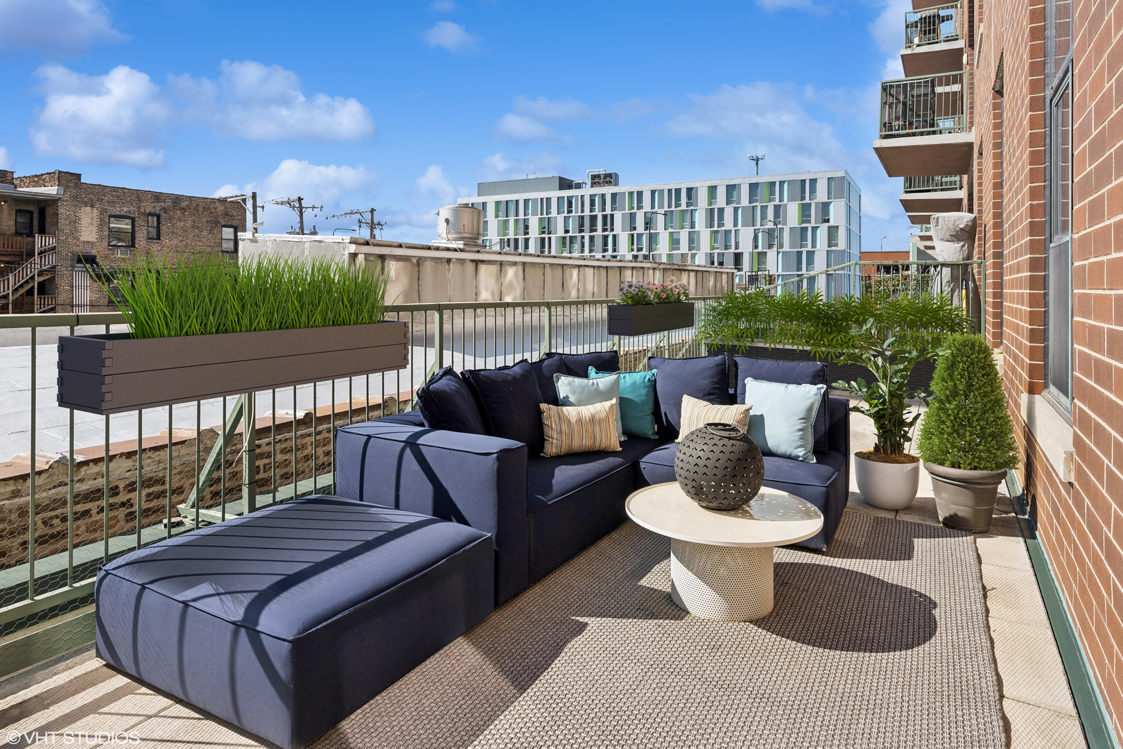 3631 North Halsted Street, Unit 208 Chicago, IL 60613 - Photo 12 of 19 a view of balcony with couch and chairs