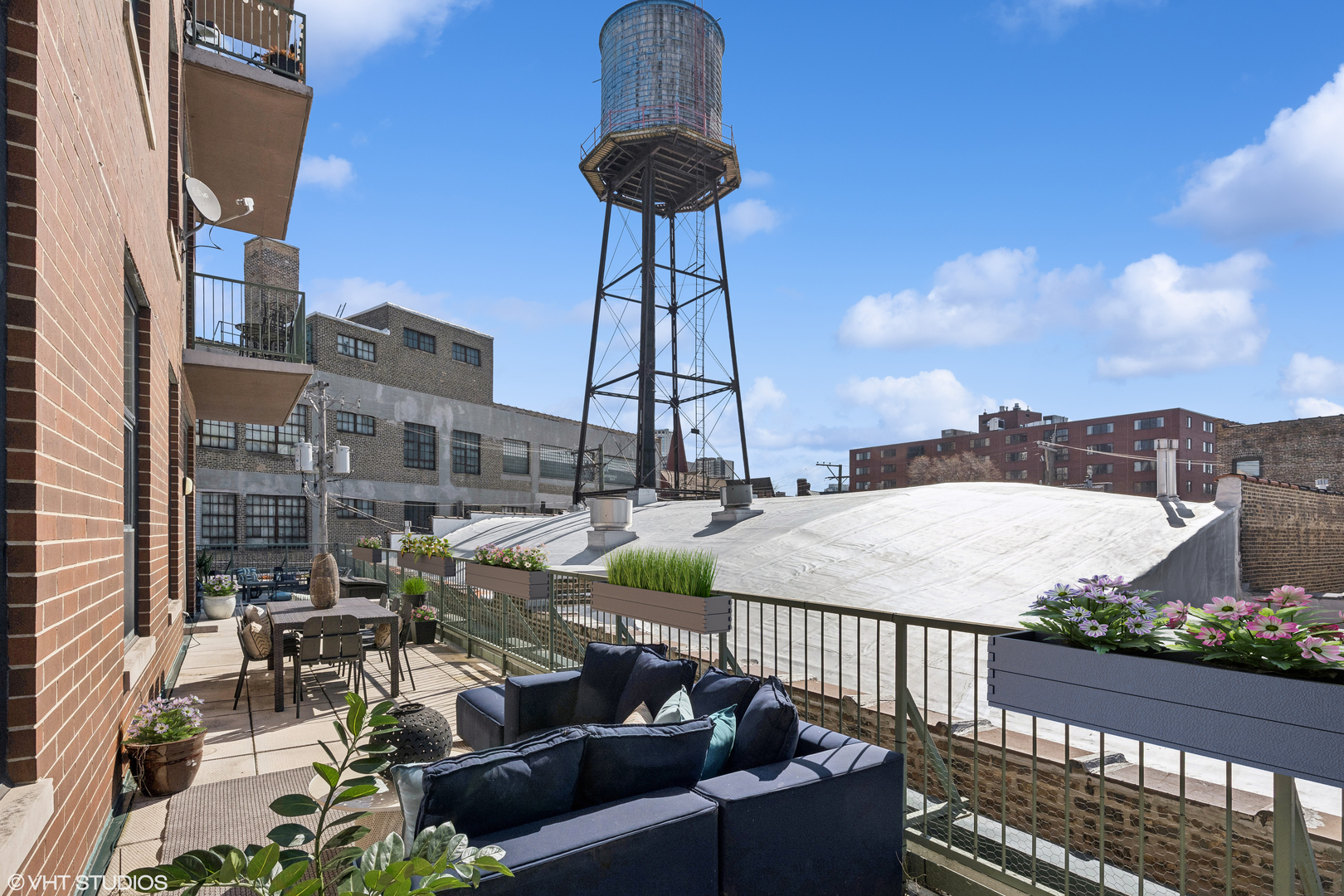 3631 North Halsted Street, Unit 208 Chicago, IL 60613 - Photo 13 of 19 a view of a balcony with furniture