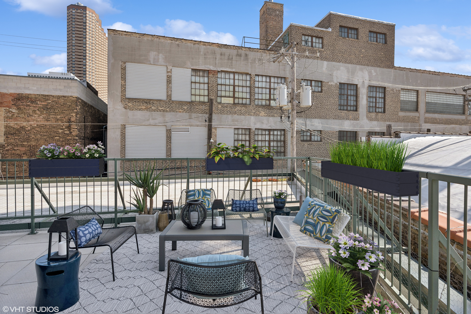 3631 North Halsted Street, Unit 208 Chicago, IL 60613 - Photo 15 of 19 a view of a patio with couches table and chairs and potted plants