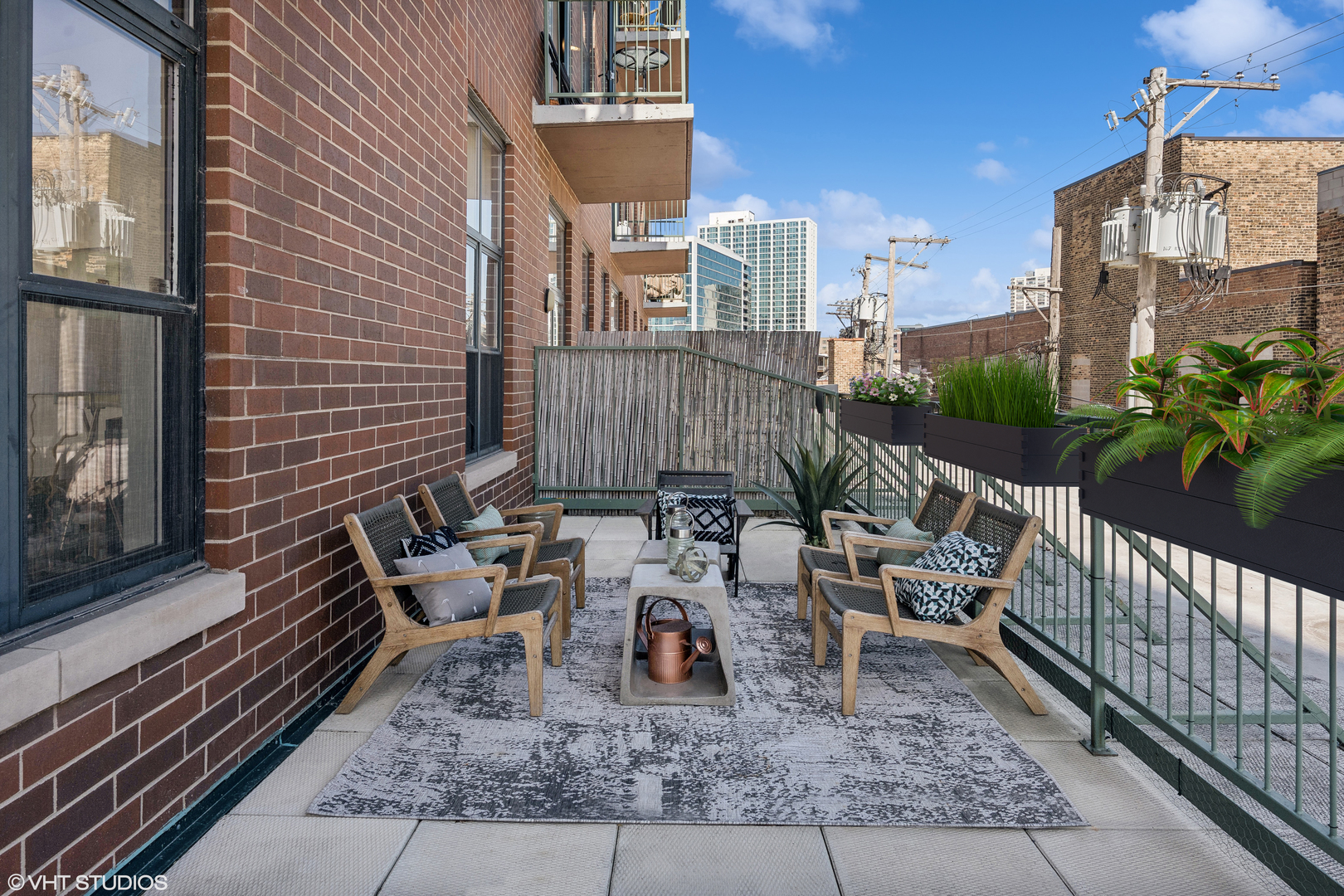 3631 North Halsted Street, Unit 208 Chicago, IL 60613 - Photo 17 of 19 a view of a patio with couches table and chairs and potted plants