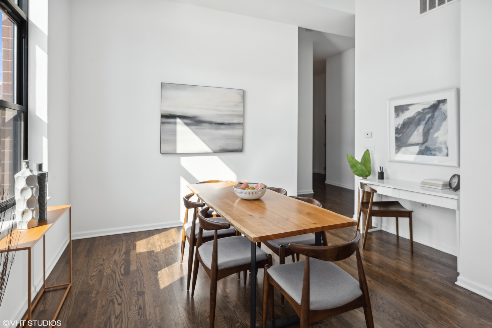 3631 North Halsted Street, Unit 208 Chicago, IL 60613 - Photo 6 of 19 a view of a dining room with furniture and wooden floor