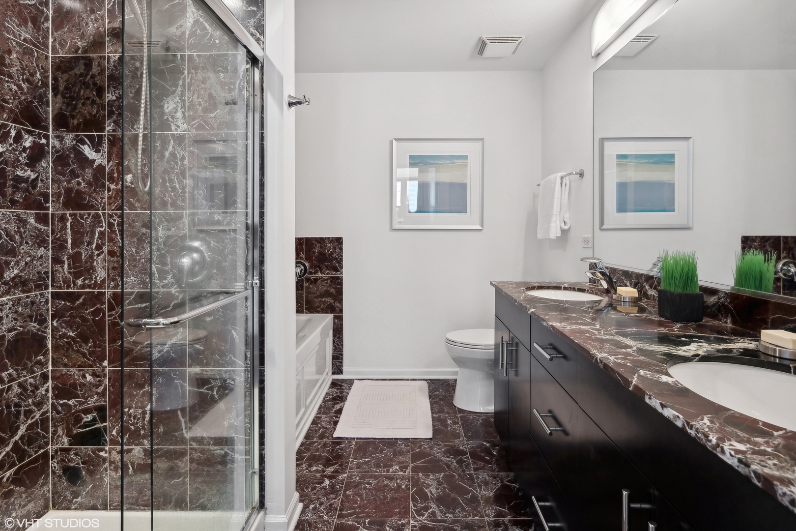 3631 North Halsted Street, Unit 208 Chicago, IL 60613 - Photo 9 of 19 a bathroom with a granite countertop sink a toilet and shower