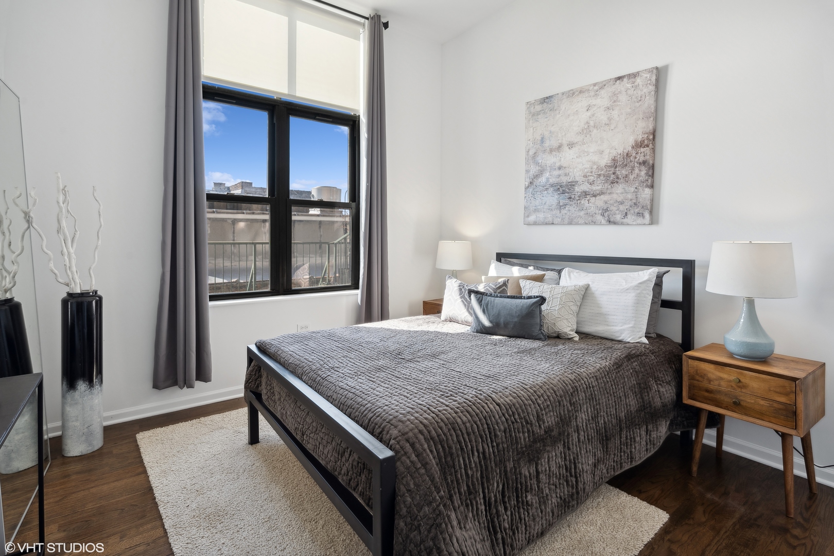 3631 North Halsted Street, Unit 208 Chicago, IL 60613 - Photo 10 of 19 a bedroom with furniture and a window
