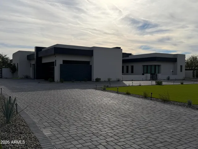 a view of a house with swimming pool and porch