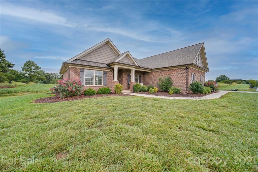 3103 East Brief Road Monroe, NC 28110 - Photo 3 of 41 a front view of house with garden