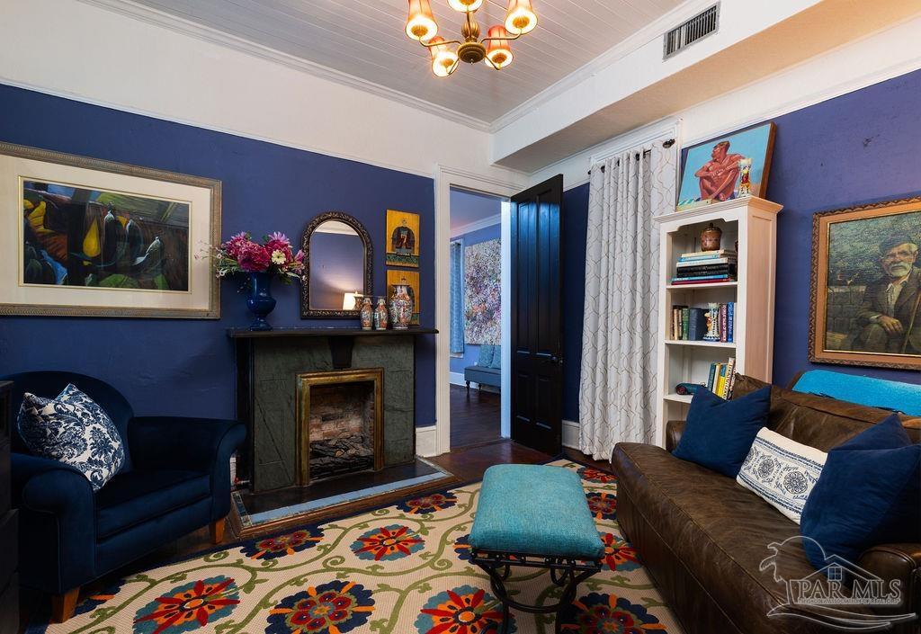 714 East La Rua Street Pensacola, FL 32501 - Photo 35 of 63 a living room with furniture and a fireplace
