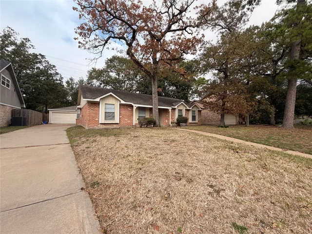 a house with trees in front of it