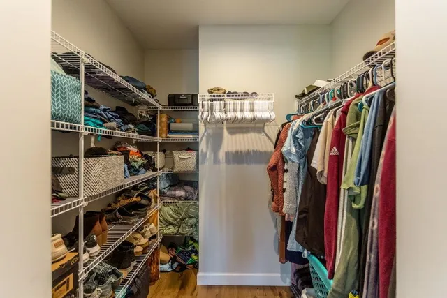 a bathroom with a double vanity sink a mirror and shower