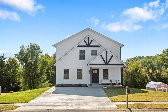a front view of a house with a yard