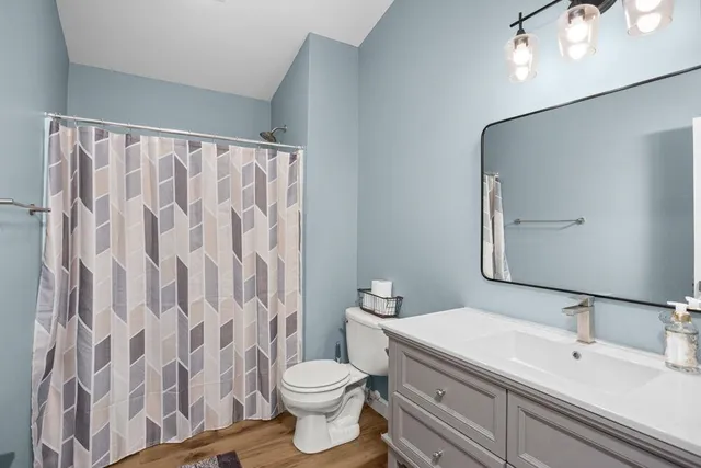 a spacious bedroom with a bed and window