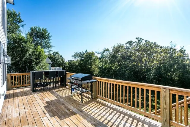a view of balcony with wooden floor and seating space