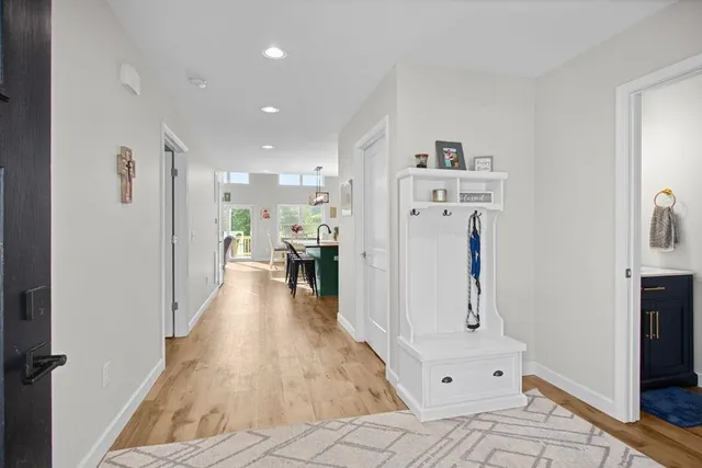 a view of kitchen with furniture and wooden floor