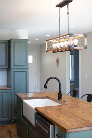 a kitchen with a table and chairs