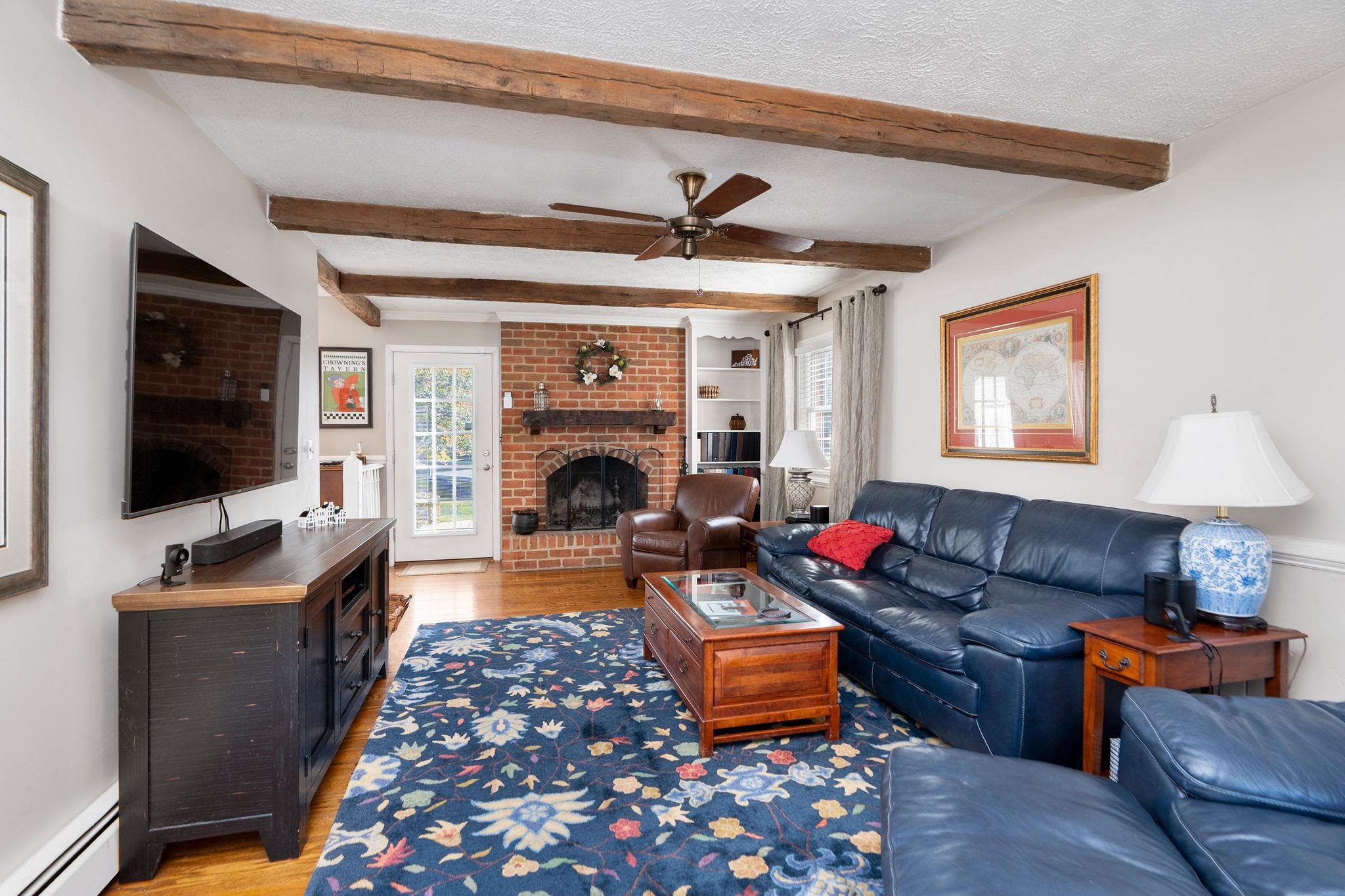 112 Country Lodge Road Waynesboro, VA 22980 - Photo 14 of 74 a living room with furniture a flat screen tv and a fireplace