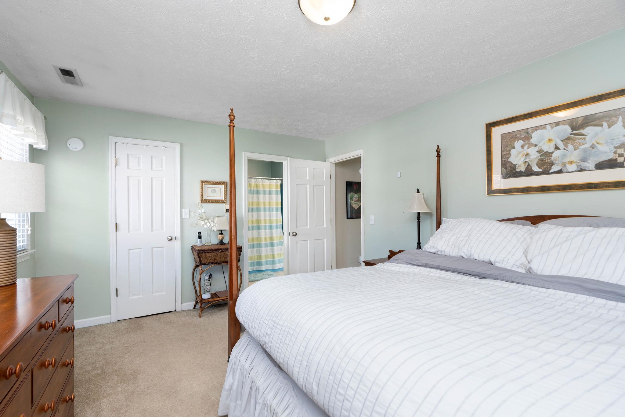 112 Country Lodge Road Waynesboro, VA 22980 - Photo 21 of 74 a spacious bedroom with a bed and a painting on the wall