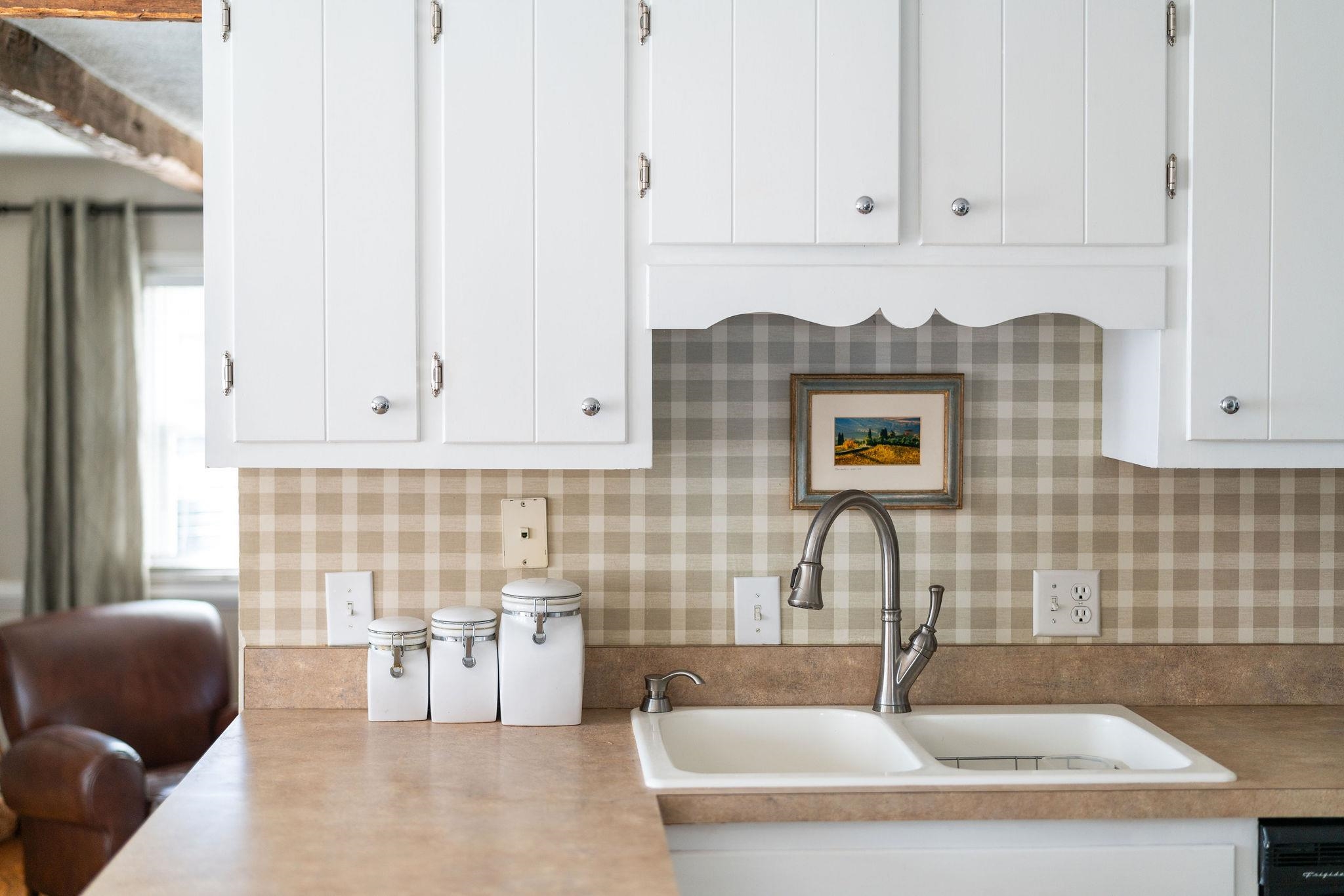 112 Country Lodge Road Waynesboro, VA 22980 - Photo 39 of 74 a kitchen with stainless steel appliances a sink a stove and white cabinets