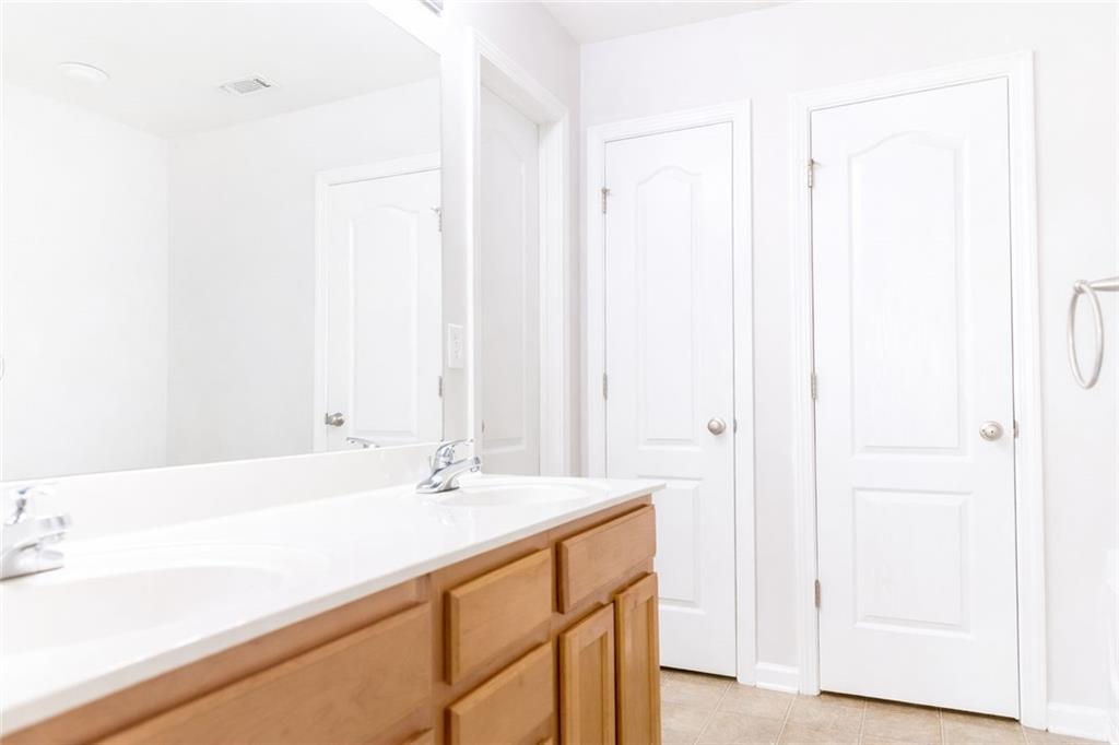544 Ridge View Crossing Woodstock, GA 30188 - Photo 21 of 41 a bathroom with a sink and a mirror