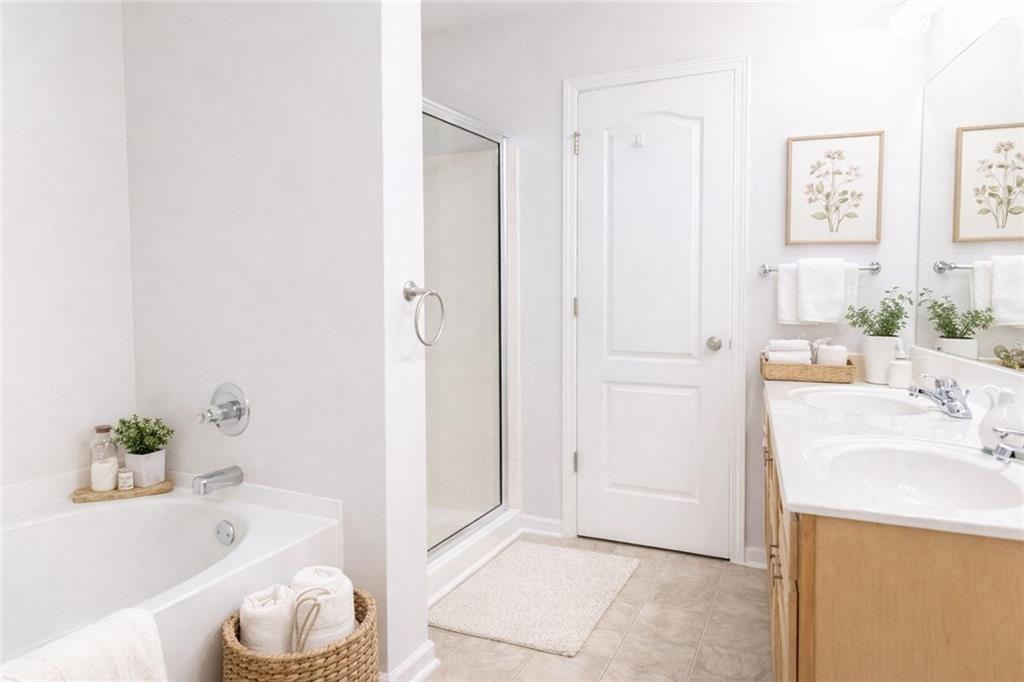 544 Ridge View Crossing Woodstock, GA 30188 - Photo 23 of 41 a bathroom with a tub sink and a mirror