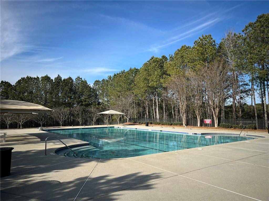 544 Ridge View Crossing Woodstock, GA 30188 - Photo 36 of 41 a view of outdoor space with swimming pool and trees