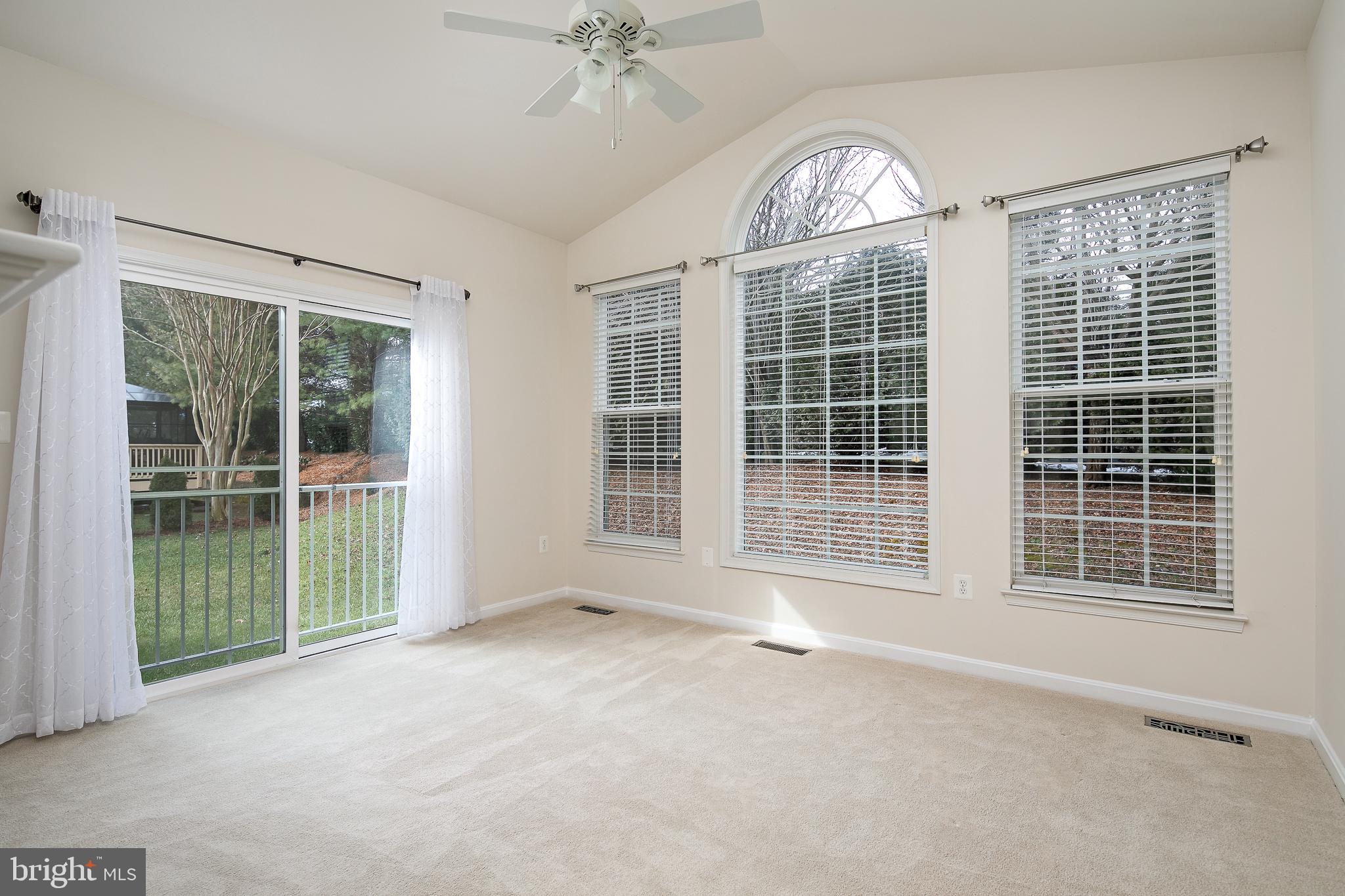 450 Blossom Tree Road Culpeper, VA 22701 - Photo 7 of 32 Sunroom backs to trees for privacy.