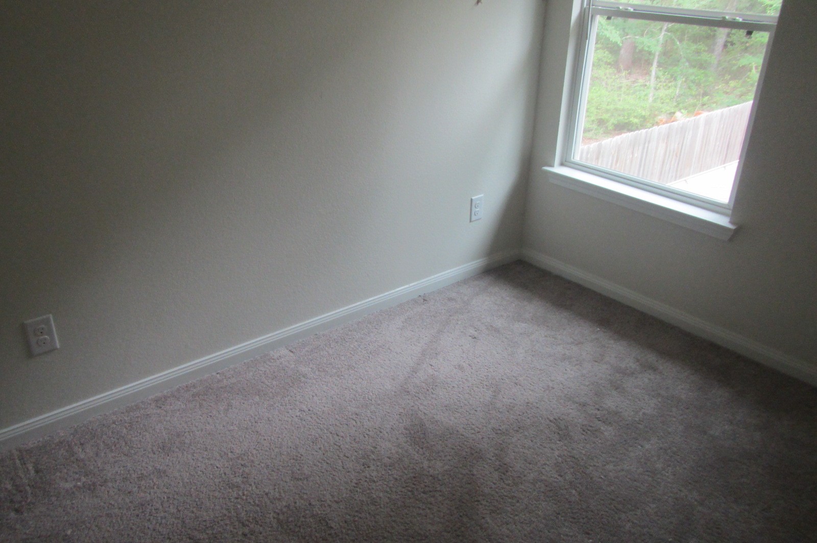 28612 Netawake Court Point Blank, TX 77364 - Photo 4 of 14 an empty room with a window