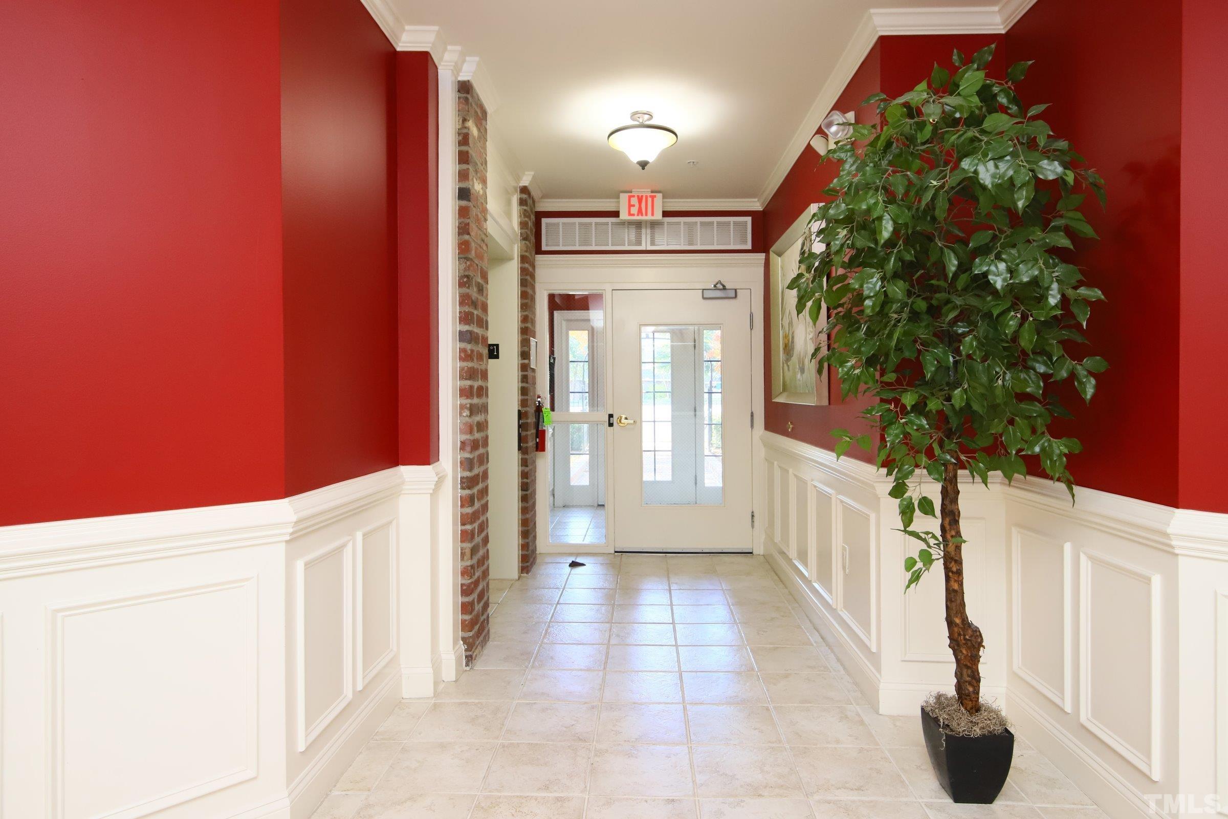7530 Lead Mine Road, Unit 100 Raleigh, NC 27615 - Photo 3 of 26 a view of a hallway with windows