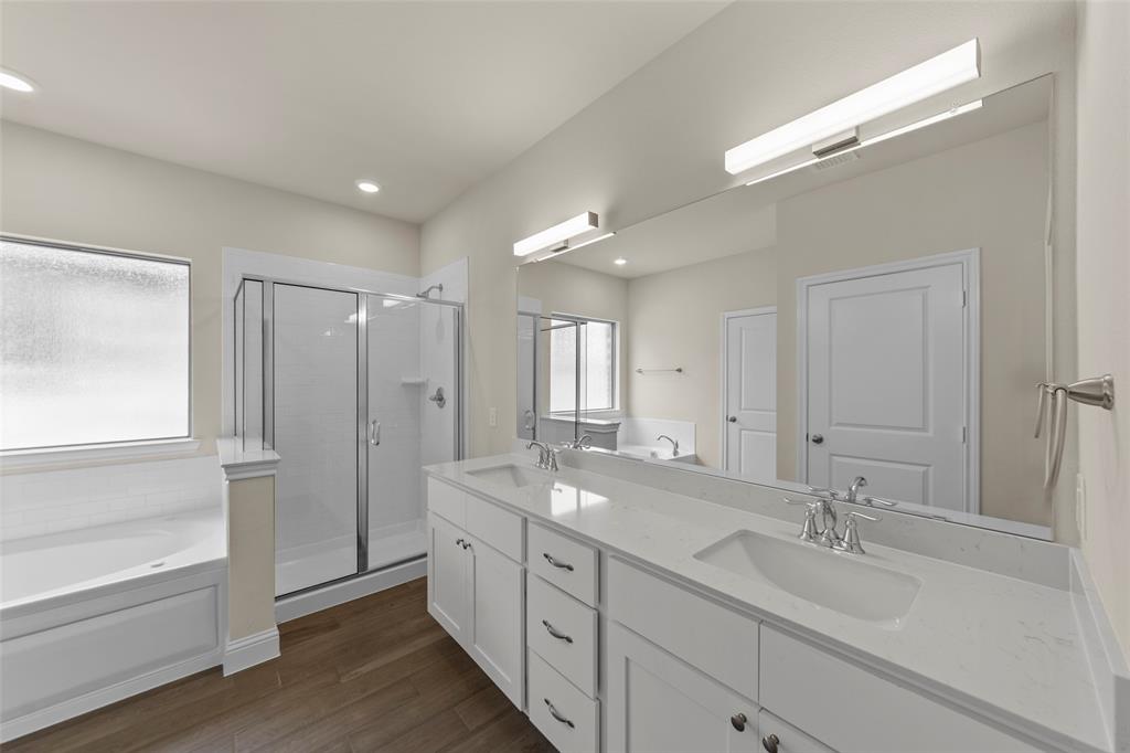 1508 Addison Lane Lancaster, TX 75134 - Photo 11 of 20 Double vanity with white cabinetry, integrated sinks, and polished chrome fixtures