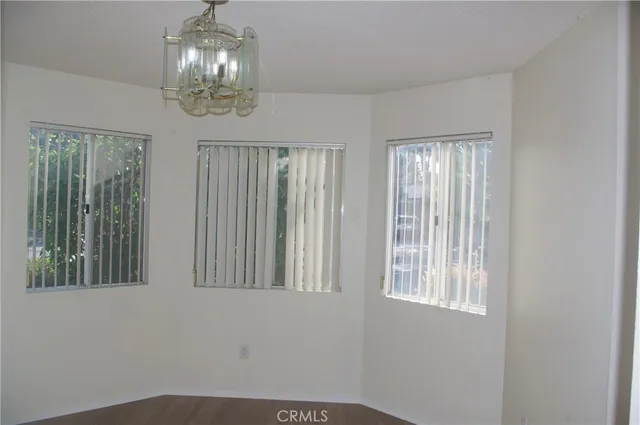 a bathroom with a light fixture and a mirror